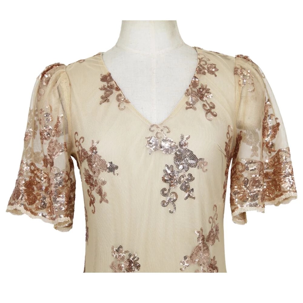 Damska cekinowa sukienka z bufiastym rękawem - obrazek 4