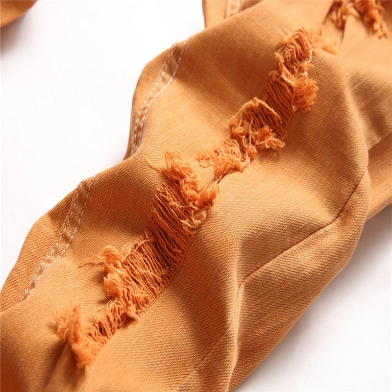 Męskie spodnie slim z przetarciami - obrazek 4